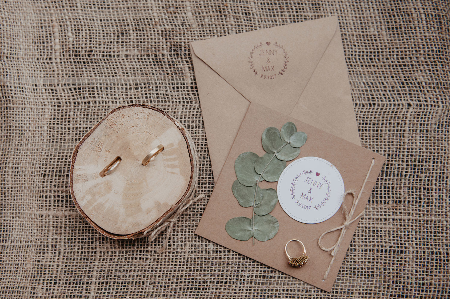 boho wedding rings and stationary on jute