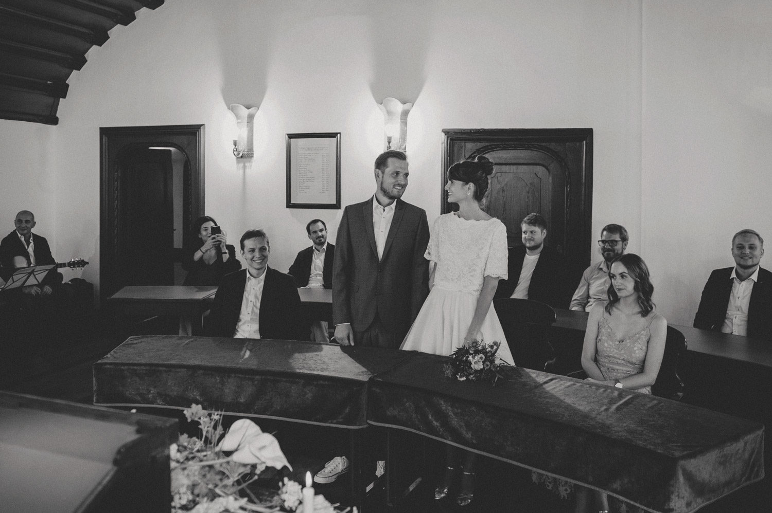 bride and groom smiling at each other during bohemian registry office ceremony in noerdlingen germany