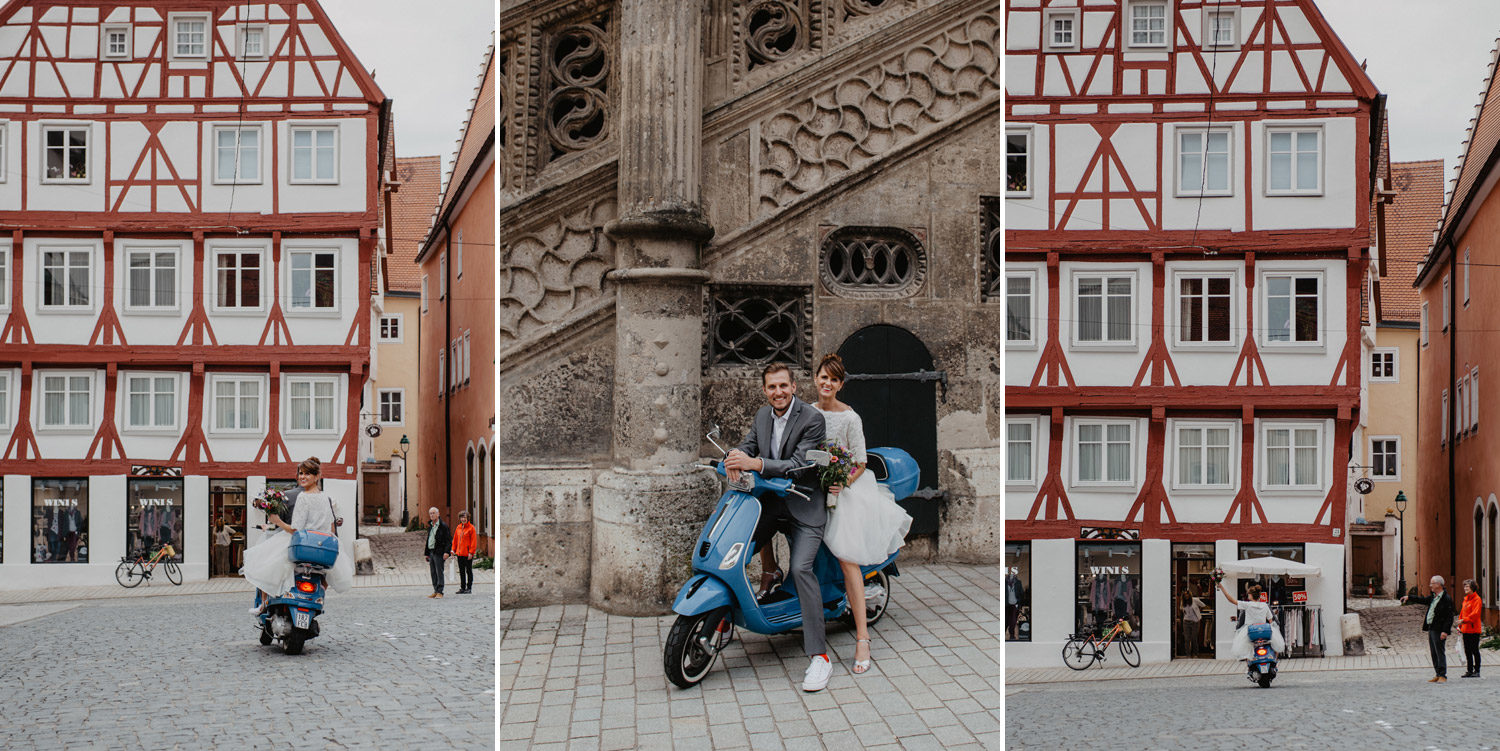 boho bride and groom riding away on blue scooter