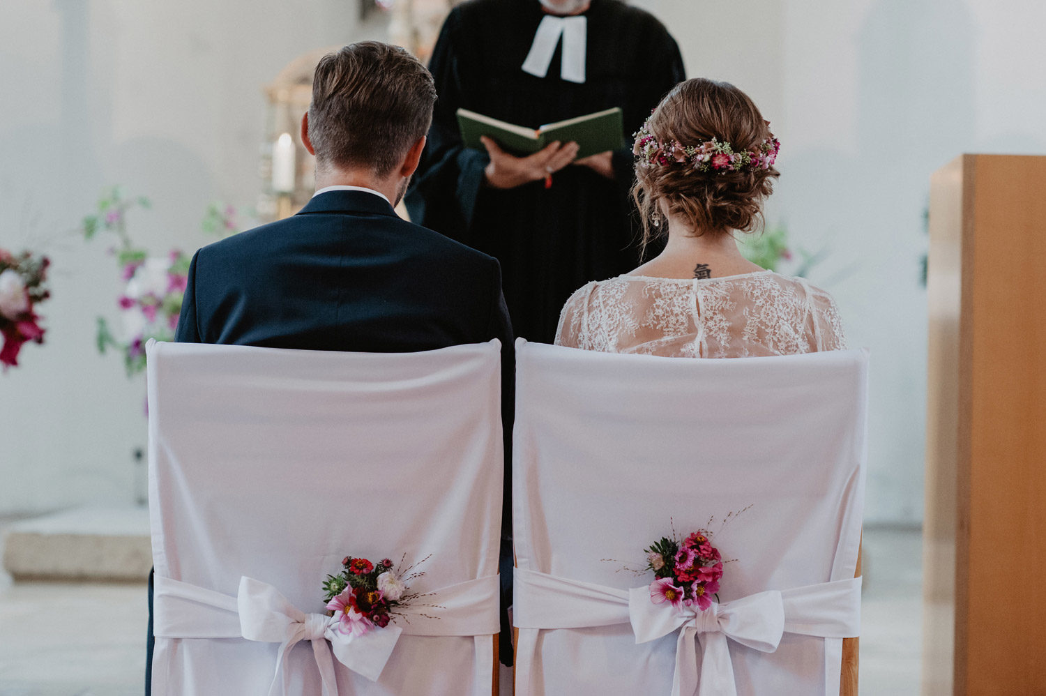 rustic flower crown and chair decoration at boho wedding in swedish church
