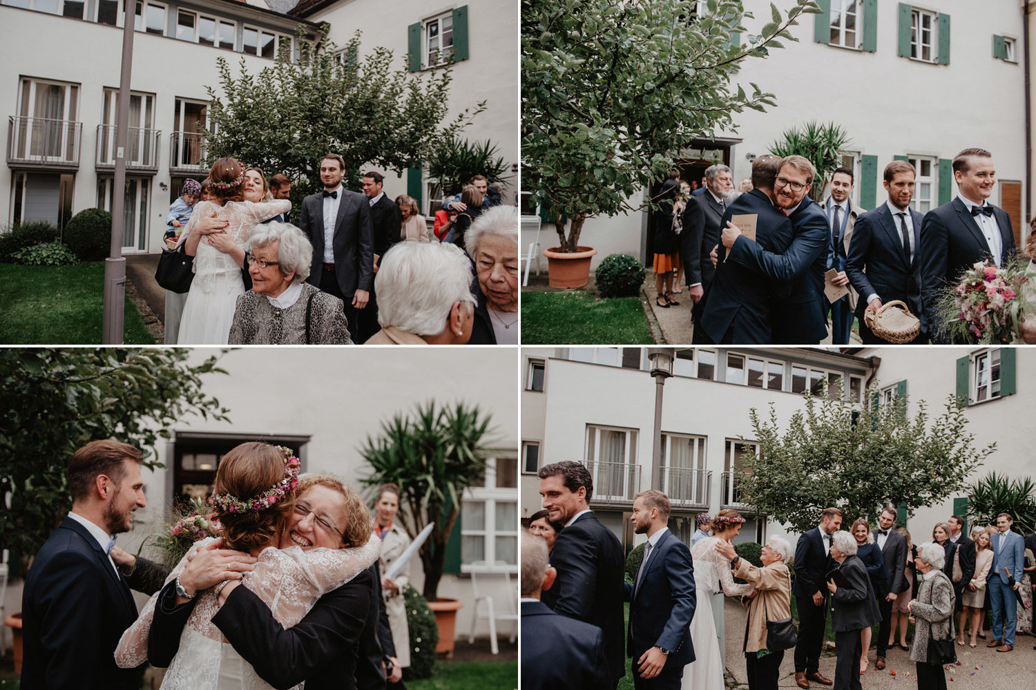 guests hugging bride and groom outside modern curch