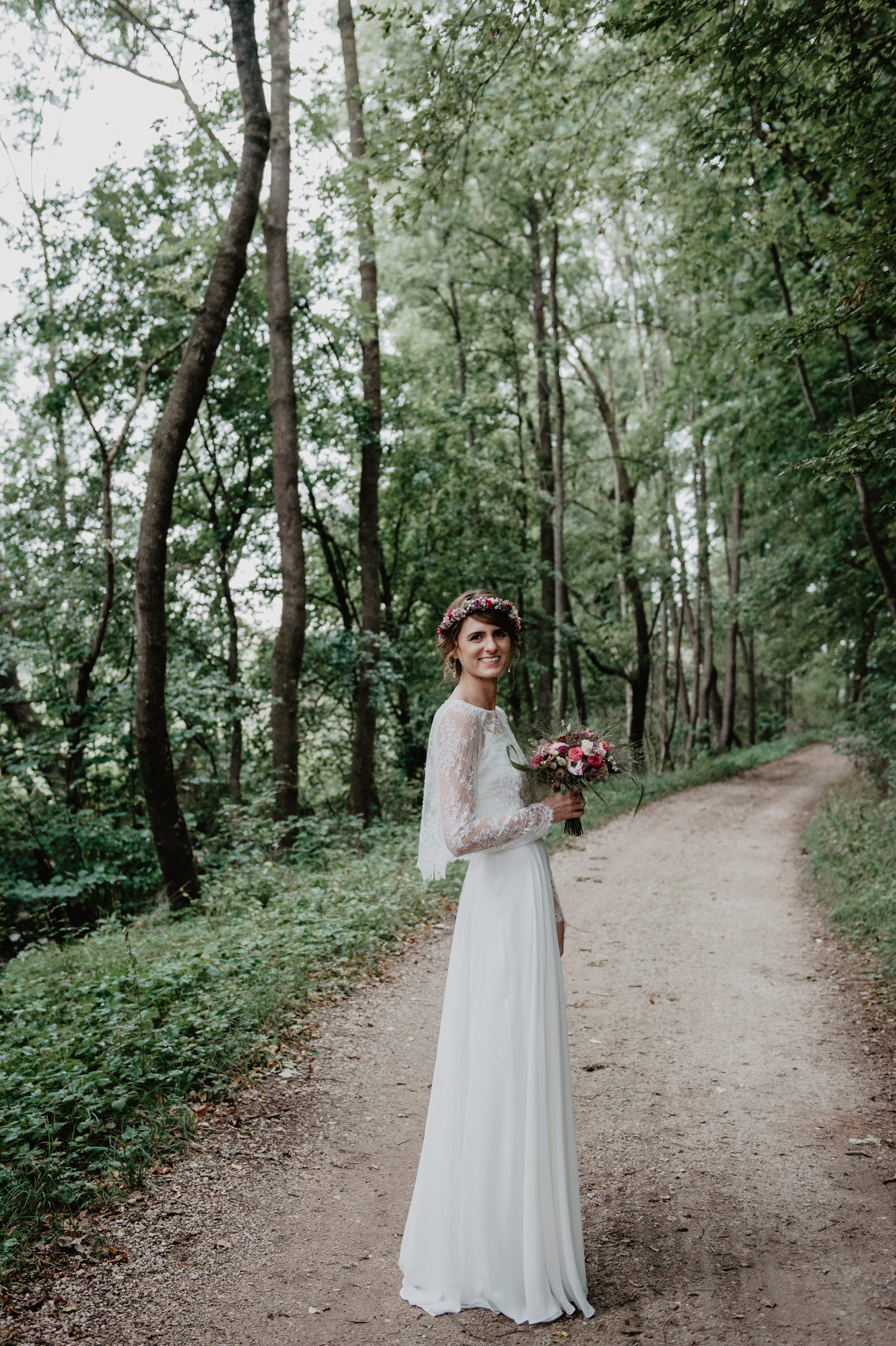 bride wearing elfenkleid lace vintage wedding dress and meadow flower crown