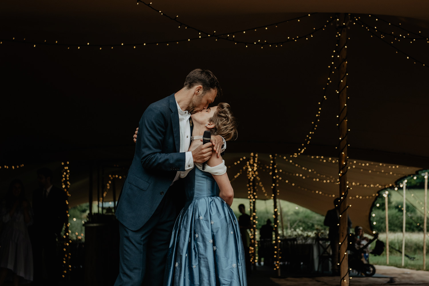 elegant english country garden wedding with blue dress by paula nadal featured in vogue by anne schwarz photography