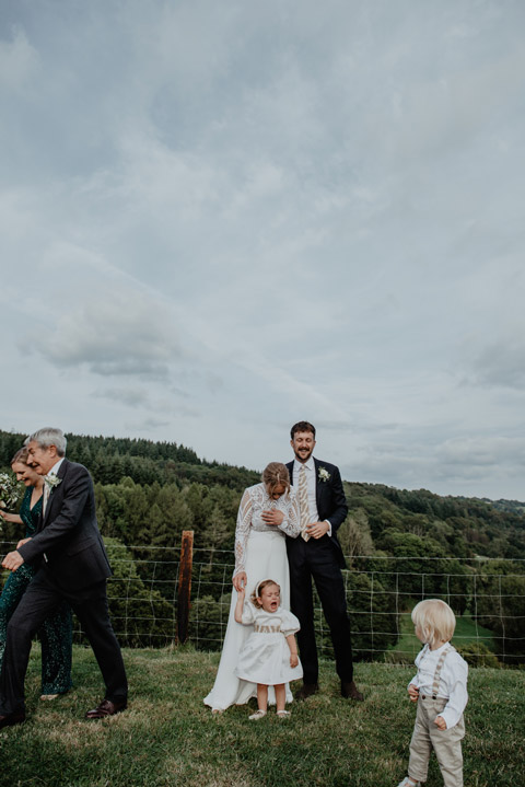 fun wedding family group photo at barn wedding anne schwarz