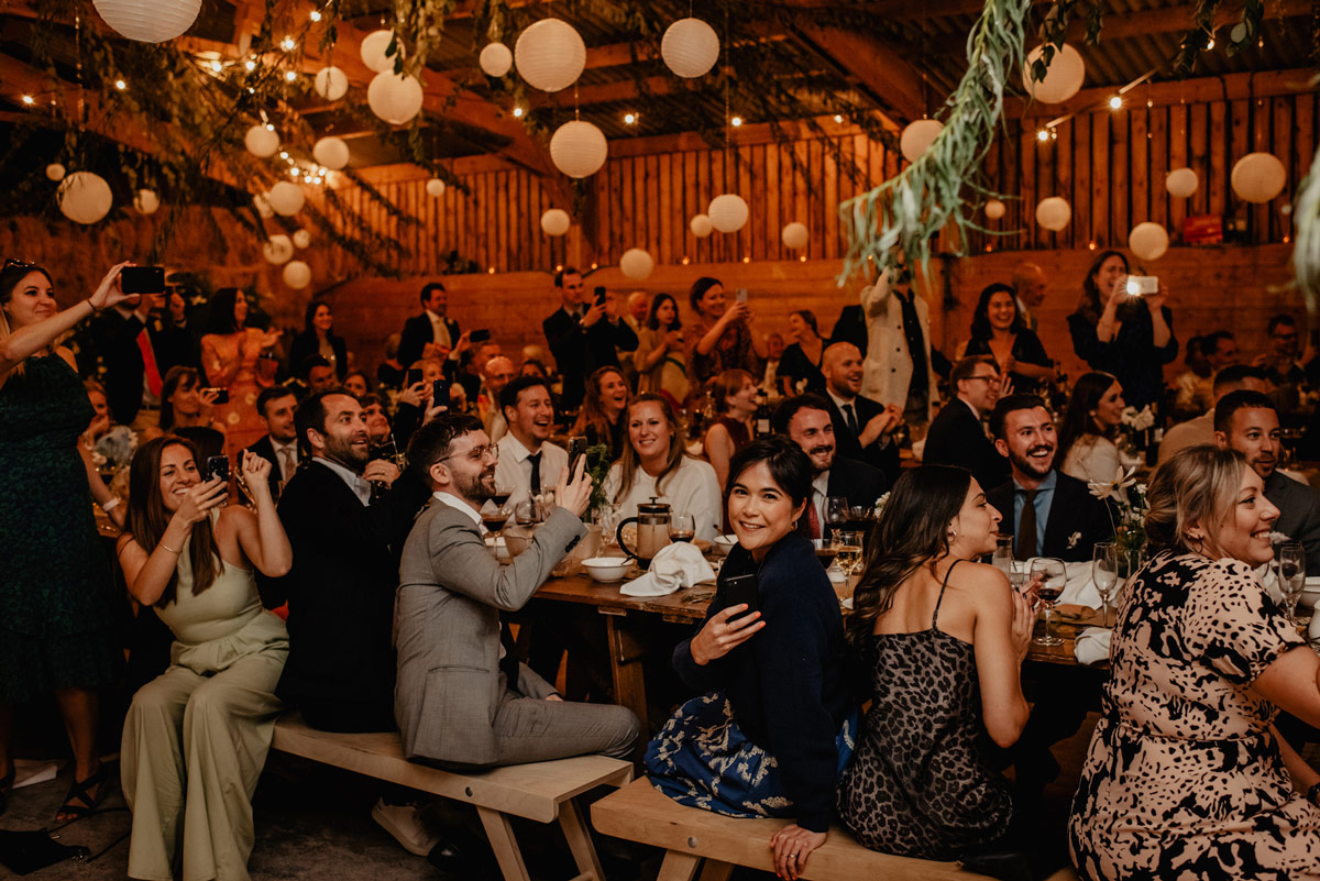 guests enjoying brass band at relaxed barn wedding in monmouthshire